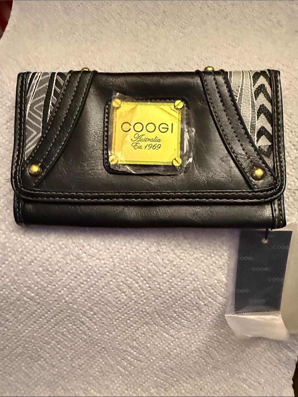 COOGI Black Wallet with Gold Plaque and Gray Pattern Accents